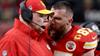 Travis Kelce confers with his coach